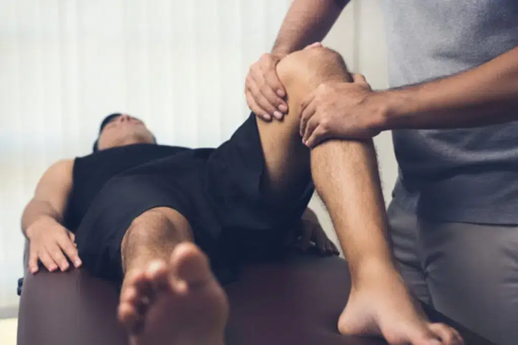 Patient receiving treatment for a sports injury from a Doctor